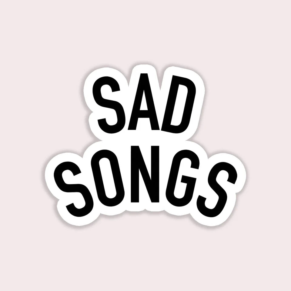 Sticker with 'SAD SONGS' text on a light pink background